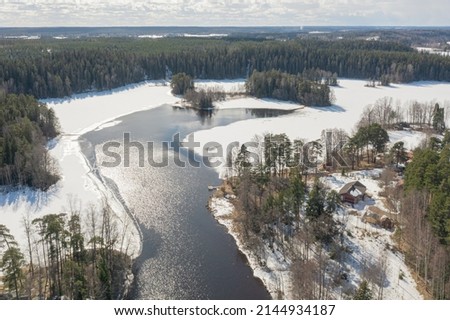 Countryside Winter landscape over the forest Aerial photo. Scandinavia. Finland.