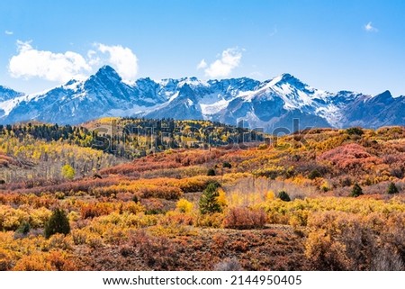 Golden autumn aspen trees in the San Juan Mountains of Colorado Royalty-Free Stock Photo #2144950405