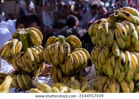 Ripe bananas at the city market. Arabic fruit and vegetable market. Tourist attractions in Egypt, city tour. Royalty-Free Stock Photo #2144957439