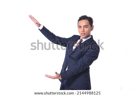  portrait of a young businessman in black suit with white shirt ,tie   with hands gesture standing on white background