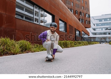 portrait of a skater. A skateboarder at an urban location . man enjoys the ride
