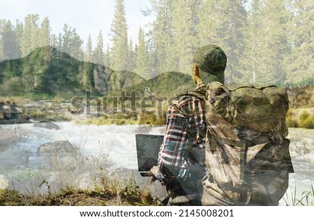 one hiker men with laptop in the forest. double exposure photo
