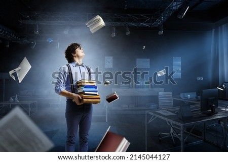 World of books concept with a student Royalty-Free Stock Photo #2145044127