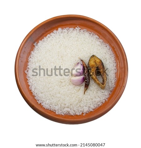 Panta ilish Bengali new year festive dish. Boishakh panta ilish with chilli and onion. Panta bhat is popular among Bengali's in India and Bangladesh. Hilsha fry into clay plate bowl shanki  or sanki. Royalty-Free Stock Photo #2145080047