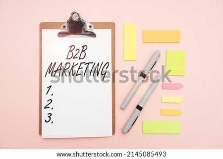 Inspiration showing sign B2B Marketing. Conceptual photo Partnership Companies Supply Chain Merger Leads Resell Multiple Assorted Collection Office Stationery Photo Placed Over Table