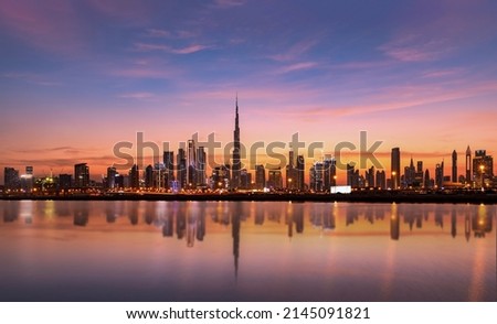 Panoramic Dubai skyline with Reflection in Pastel Sunset colors  Royalty-Free Stock Photo #2145091821