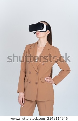 Portrait of a businesswoman in virtual glasses. A virtual reality. Future technologies.