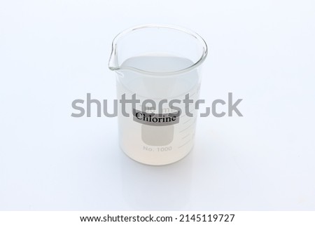 chlorine solution in glass, Chlorine is used to kill bacteria or to perform experiment in laboratory  Royalty-Free Stock Photo #2145119727