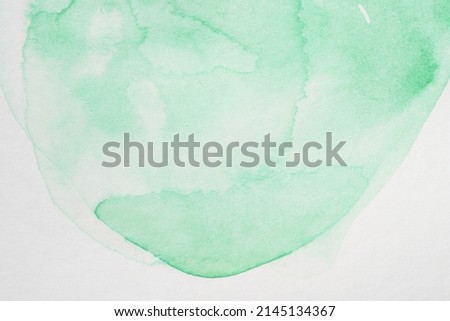 Abstract green watercolor hand painting on paper background, watercolor background