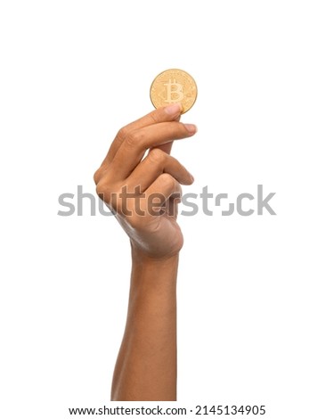 cryptocurrency, finance and business concept - close up of female hand holding golden bitcoin over white background Royalty-Free Stock Photo #2145134905