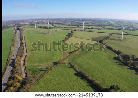 Some wind turbines in the North Devon countryside, with the North Devon Link Road in view Royalty-Free Stock Photo #2145139173