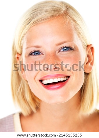 She loves to laugh. Beautiful young blond woman smiling and laughing happily.