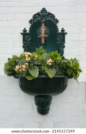 decorative element adorning the white brick wall Royalty-Free Stock Photo #2145157249