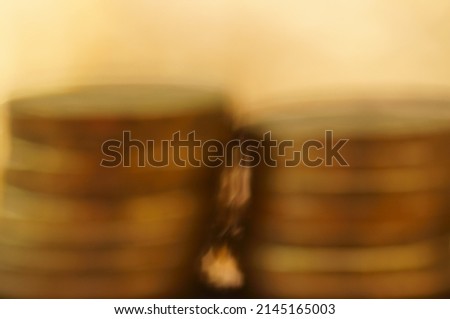 Abstract blurred background. A stack of coins in close-up. Background image. Economics and finance.
