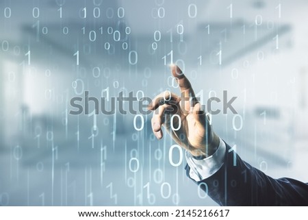 Man hand working with abstract virtual binary code illustration on blurred office background. Big data and coding concept. Multiexposure Royalty-Free Stock Photo #2145216617