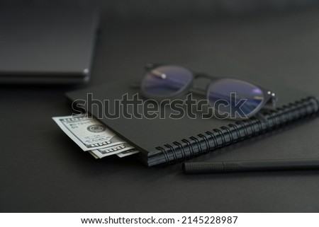 Layout of business things on a black background.