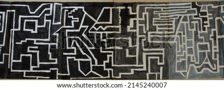 Monochrome sketch of a maze labyrinth pattern  designed with pens and markers. Digitally edited.