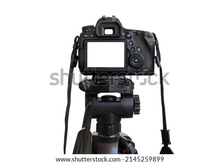 Dslr camera with white screen on the tripod isolated on white background. White screen camera Royalty-Free Stock Photo #2145259899