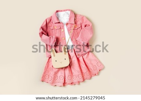 Pink Jean Jacket, white t-shirt and  cute skirt. Fashion set of childrens outfit. Set of kids clothes and accessories for girl