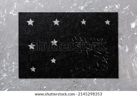 Top view of grey tablecloth for food on cement background. Empty space for your design.