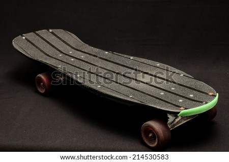 Vintage Style Black Skateboard on a black Background