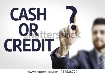Business man pointing to transparent board with text: Cash or Credit? 