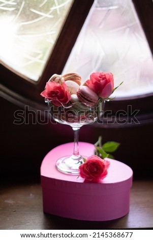 gift box in the shape of a heart with flowers and sweets, pink roses,