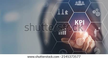 KPI concept. Key Performance Indicator using business intelligence metrics to measure achievement versus planned target. Touching on  "KPI" abbreviation surrounded by business goals an process icons. Royalty-Free Stock Photo #2145373577