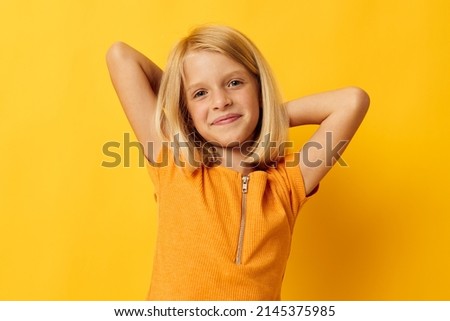 beautiful little girl blonde straight hair posing smile fun childhood lifestyle unaltered