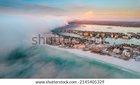 Clearwater Beach Florida. Panorama of City. Summer vacations. Beautiful View on Hotels and Resorts on Island. Turquoise Color of Ocean water. Fog over shore Gulf of Mexico. Aerial photography 