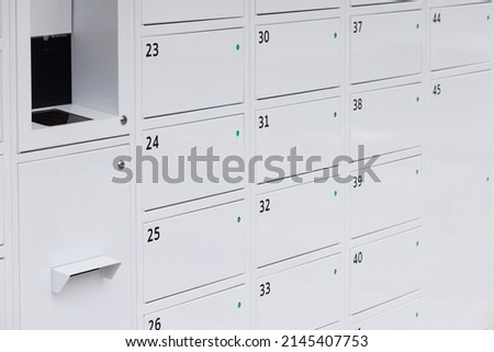 White room lockers with electronic access control. smart locker. electronic steel parcel locker, automatic mailboxes. Royalty-Free Stock Photo #2145407753
