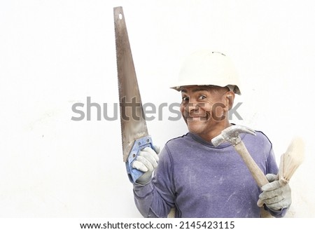professional builder holding his tools on white background with people stock photos  