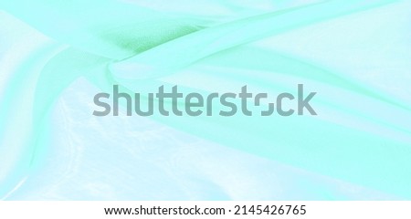 Green silk fabric texture. Beautiful pale green turquoise vintage color. feather trends. texture background