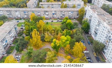 Bright autumn colors of tree leaves in a Russian residential courtyard, Novokuznetsk city, Zavodskoy district, Kemerovo region