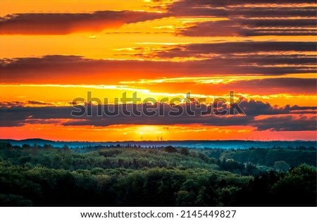 Cloudy sky at sunset landscape. Beautiful sunset in countryside. Countryside sunset landscape. Sunset sky clouds landscape Royalty-Free Stock Photo #2145449827