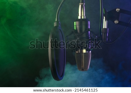 Professional Microphone in Recording Studio, Professional Studio, Colorful vibrant background.Vocal and music concept, karaoke