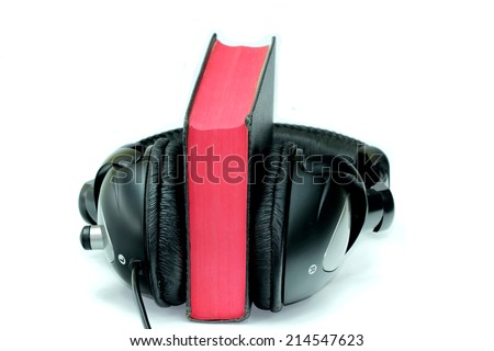 Bible and headphones on white background