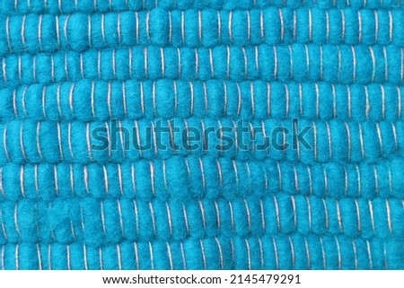 Blue natural yarn wool background. Surface of fabric texture in sky blue color. Blue turquoise woven texture seamless pattern.