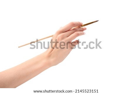 Female hand with brush on white background. Hand with a brush Royalty-Free Stock Photo #2145523151