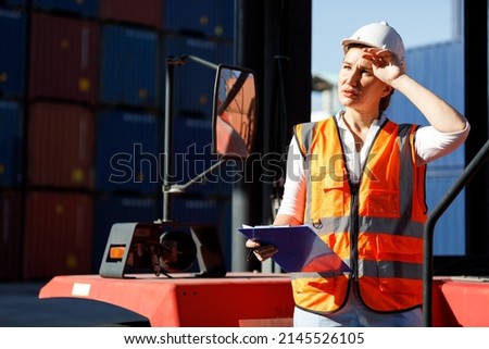 factory workers or engineer feeling tired for working in containers warehouse storage Royalty-Free Stock Photo #2145526105