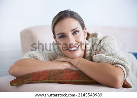 Making the most of her time off. Cropped shot of an attractive young woman relaxing on the sofa at home. Royalty-Free Stock Photo #2145548989