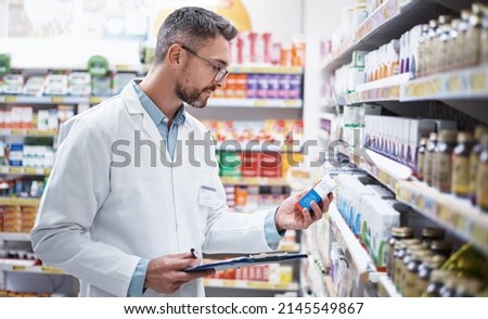 Stocking the shelves is top priority. Shot of a mature pharmacist doing inventory in a pharmacy.