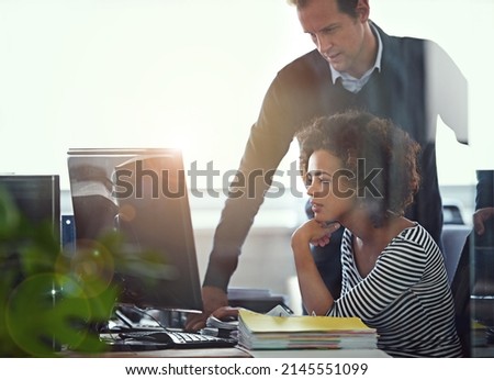 She needed a second opinion. Cropped shot of two colleagues working together in the office. Royalty-Free Stock Photo #2145551099