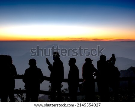 The Silhouette Tourists Taking Pictures of The Sunrise in Pho Ruea, Loei Province Thailand
