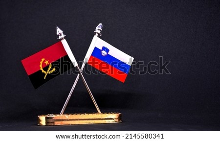 Angola and Slovenia table flag with black Background