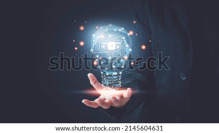 Artificial intelligence (AI) concept. Hand hold brain with shining wireframe, Neural networks in light bulb of business networking technology innovation. Royalty-Free Stock Photo #2145604631