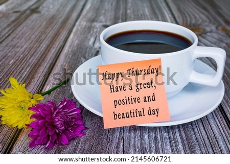 Motivational quote written on sticky note with white coffee cup and flowers. Royalty-Free Stock Photo #2145606721