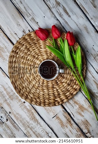 A cup of coffee, flatlay composition with flowers,  still life photography
