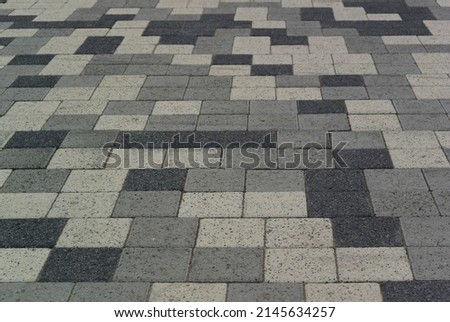 Background photo with paving slabs in gray and black. Square paving slabs. Checkered pattern.