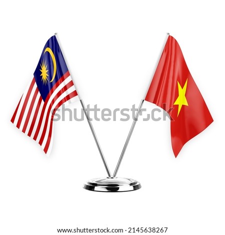 Two table flags isolated on white background 3d illustration, malaysia and vietnam